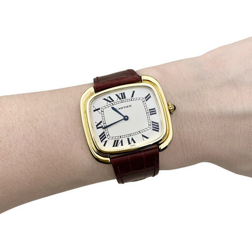 Uhr Cartier, „Square“ aus Gelbgold und Leder. 