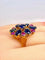 54 Importante bague or jaune, 7 saphirs et 6 rubis 58 Facettes AB454