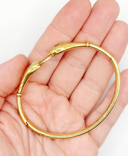 Bracelet Bracelet serpent à deux têtes or jaune et pierre bleues (circa 1920) 58 Facettes A06347