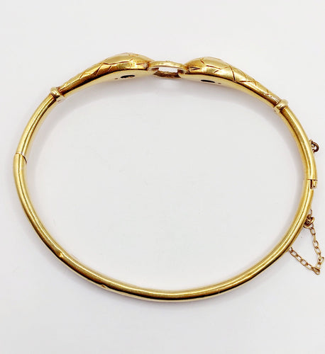 Bracelet Bracelet serpent à deux têtes or jaune et pierre bleues (circa 1920) 58 Facettes A06347