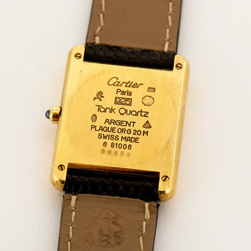 Montre Cartier - Montre Modèle "Tank Must" en argent, plaqué or et cadran noir. 58 Facettes