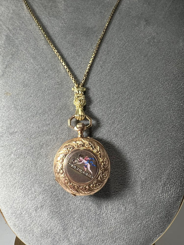 Montre Montre de col émaillé et sa chaîne en or jaune 58 Facettes 226