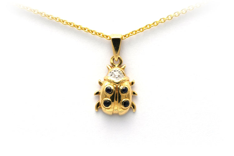 Pendentif Pendentif "coccinelle" contemporain en or jaune serti de saphirs et de diamants 58 Facettes 20754