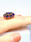 54 Importante bague or jaune, 7 saphirs et 6 rubis 58 Facettes AB454