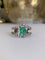 Bague 58.5 Bague en or blanc 18K sertie d’une émeraude et diamants 58 Facettes