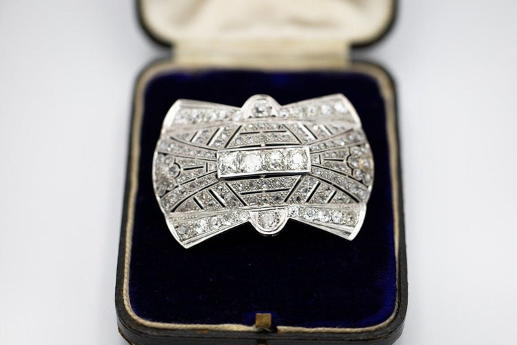 Broche Broche Art déco en platine et diamants 6,85 ct 58 Facettes PLT7