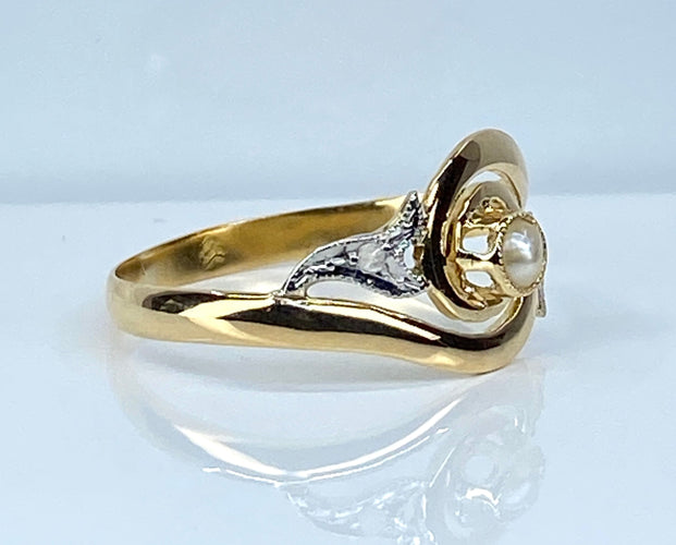 Bague 58 Bague en or jaune en perle et diamants sertis en or blanc 58 Facettes AB584