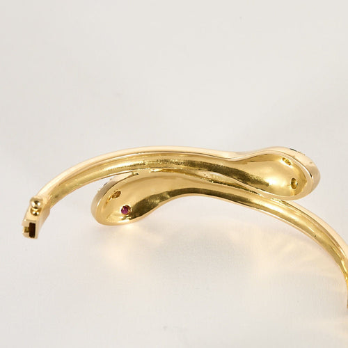 Armband "Schlange" aus Gelbgold, Rubinen und Smaragden 58 Facettes BIA1213