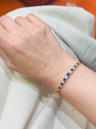 Bracelet Bracelet rigide en or jaune, diamants et saphirs 58 Facettes 259009