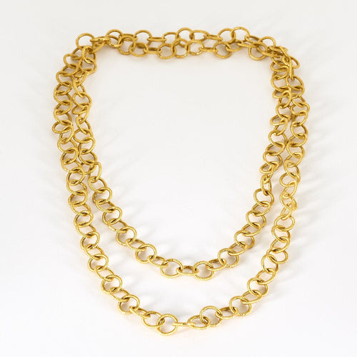 Collier Sautoir en or jaune à maillons ronds entrelacés 58 Facettes CLA0761