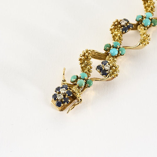 Bracelet Bracelet en or jaune, turquoises, saphirs et diamants 58 Facettes BIA1187
