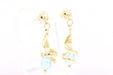 Boucles d'oreilles Boucles d'oreilles contemporaines en or jaune serties de topazes et de perles 58 Facettes 21523