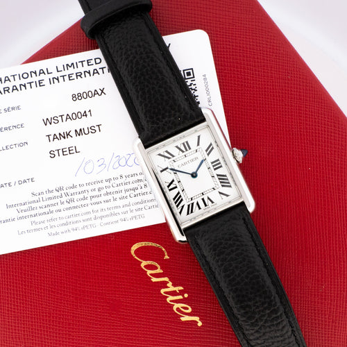 Montre Cartier - Montre Tank Must Medium cadran ivoire chiffres romains 58 Facettes