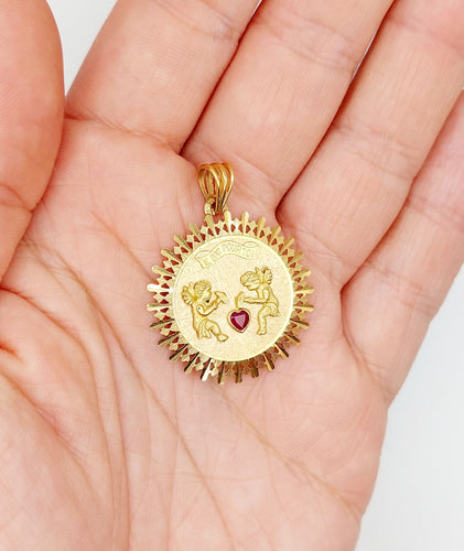 Pendentif Pendentif médaille d'amour or rose, angelots articulés "Il Bat Pour Toi" et rubis synthétique 58 Facettes A05878