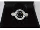 Bague 54 Bague entourage en or blanc avec gros diamants et un diamant noir 58 Facettes 2049