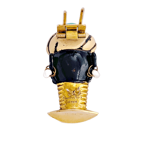 Broche Broche ancienne Cartier, "Tête de Maure", or jaune, argent, émail, diamants, turquoise. 58 Facettes 34520