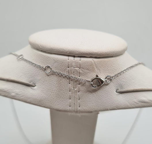 Collier Collier or blanc serti d’un pendentif HAI en diamants 58 Facettes