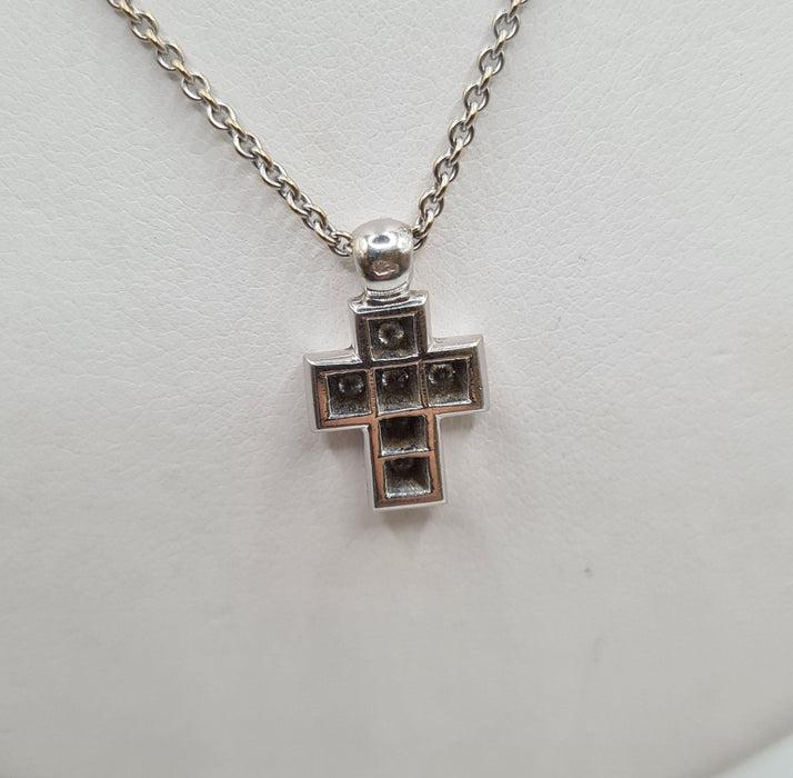 White gold cross necklace and pendant set with diamonds