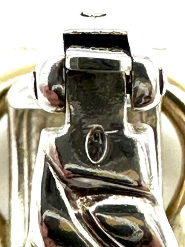 Boucles d'oreilles HERMES. Collection "Boucle sellier", boucle d'oreille argent et or 18K 58 Facettes