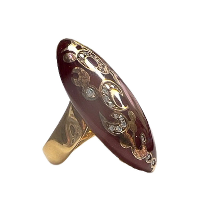 gold ring with diamonds and red enamel