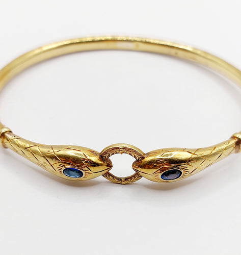 Bracelet Bracelet serpent à deux têtes or jaune et pierre bleues (circa 1920) 58 Facettes A06347