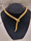 Collier Collier Serpenti vintage en or jaune 18kt avec émeraudes et rubis 58 Facettes