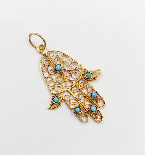Pendentif Pendentif vintage or jaune Main de fatma orné de turquoises (circa 1950) 58 Facettes A04727