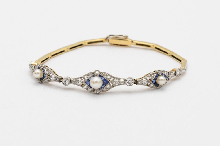 Bracelet Bracelet Art Déco avec diamants, perles et saphirs synthétiques en or jaune et platine 58 Facettes 9530