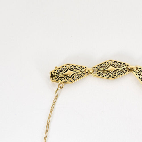 Bracelet Bracelet en or jaune ciselé et ajouré à motif de volutes 58 Facettes PAL3488X3