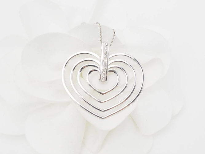 Collier Collier en or blanc et 4 coeurs 58 Facettes 26383