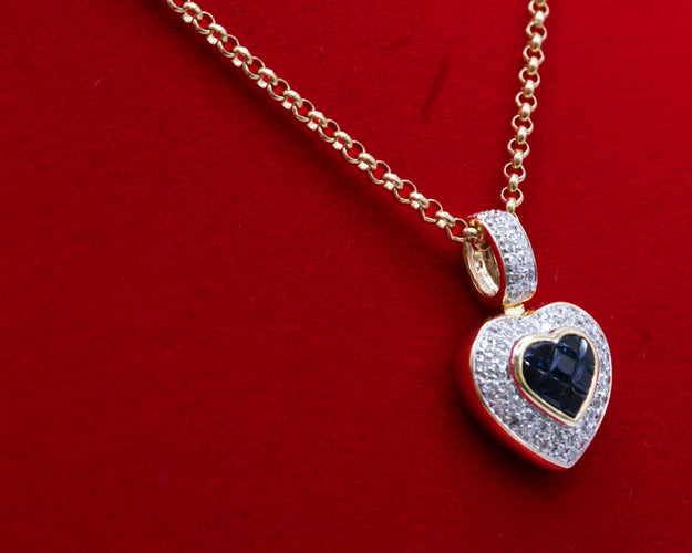 Pendentif Pendentif coeur or bicolore, saphirs, diamants 58 Facettes 250253