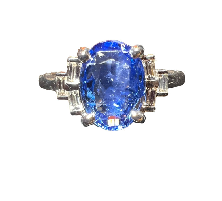 Ceylon sapphire ring surrounded by calibrated diamonds