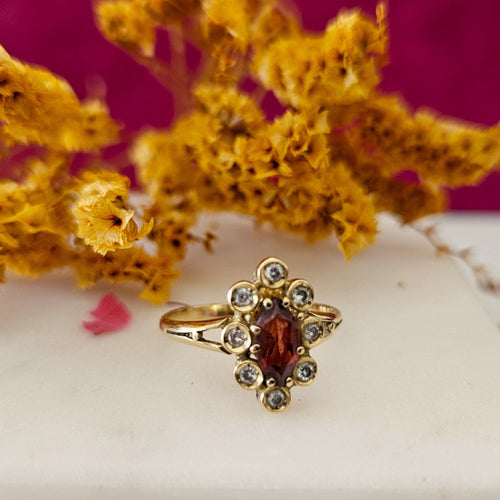 Bague Bague marguerite or jaune grenat diamants 58 Facettes MG3