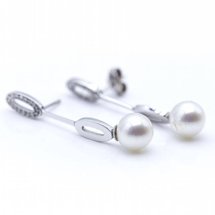 Boucles d'oreilles Boucles d'oreilles longues en or blanc et perles 58 Facettes N102863LF