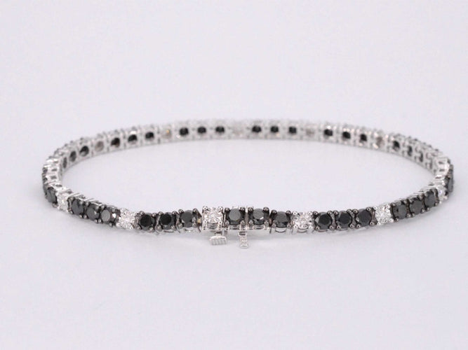Bracelet Bracelet de tennis en or blanc serti de diamants noirs et blancs 58 Facettes 2119