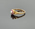 Bague 56.5 Ancienne bague fleur or jaune sertie de rubis et perle 58 Facettes