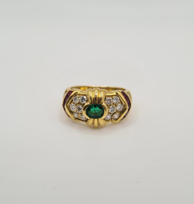 Yellow gold ring set with emerald, diamonds and rubies