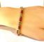 Bracelet Bracelet en or jaune, rubis calibrés et diamants 58 Facettes AB620