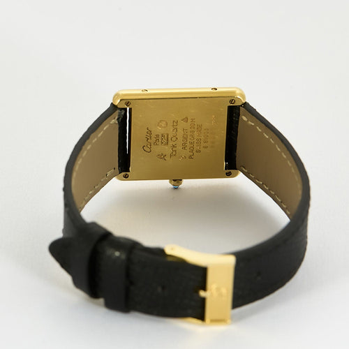 Montre Montre Cartier Modèle Tank Must en argent plaqué or cadran blanc chiffres romains. 58 Facettes