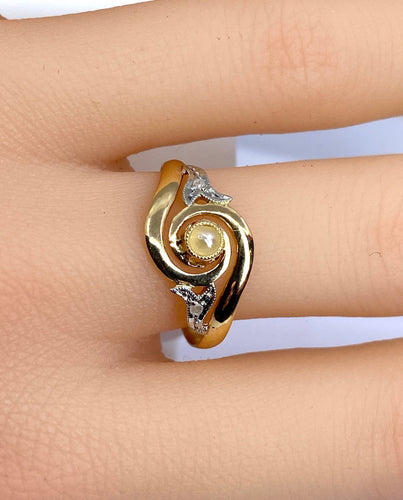 Bague 58 Bague en or jaune en perle et diamants sertis en or blanc 58 Facettes AB584