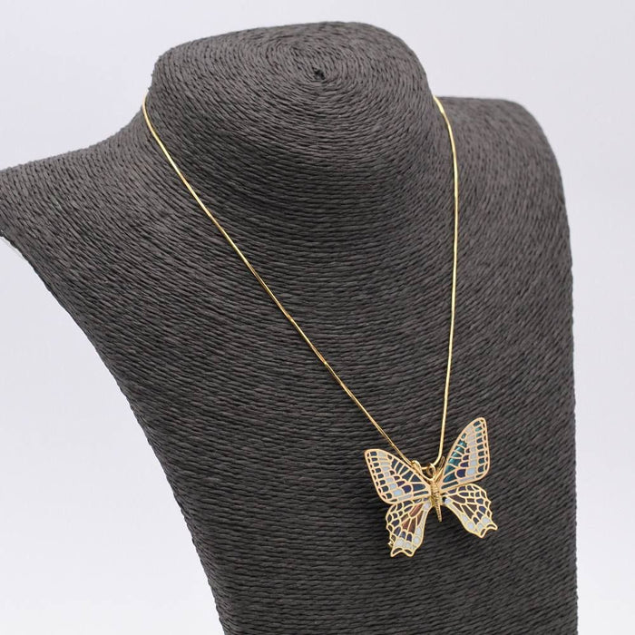 Butterfly in gold and enamel. Dual function