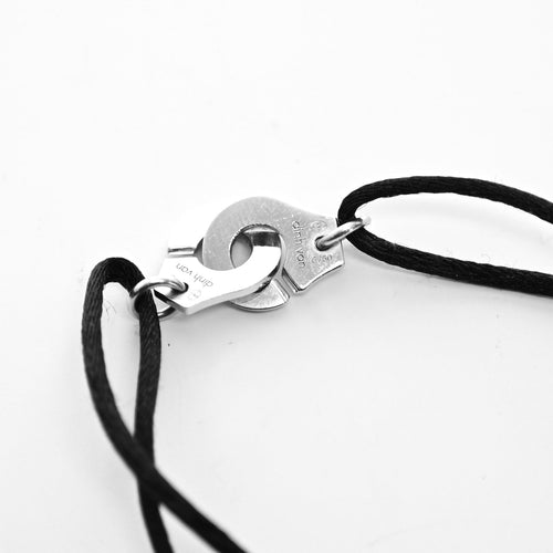 Bracelet DINH VAN - Bracelet Menottes R10 or blanc, cordon noir et diamants 58 Facettes 87176