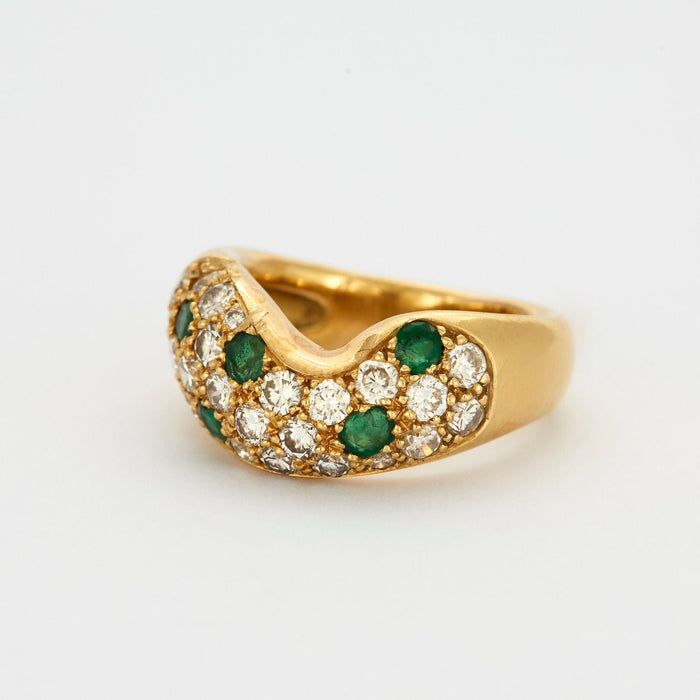 Yellow gold ring with diamonds and emeralds
