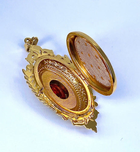 Pendentif Pendentif porte souvenir ouvrant en or et grenat 58 Facettes AB574