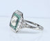 Art Deco cushion ring in platinum and diamonds, emeralds 
