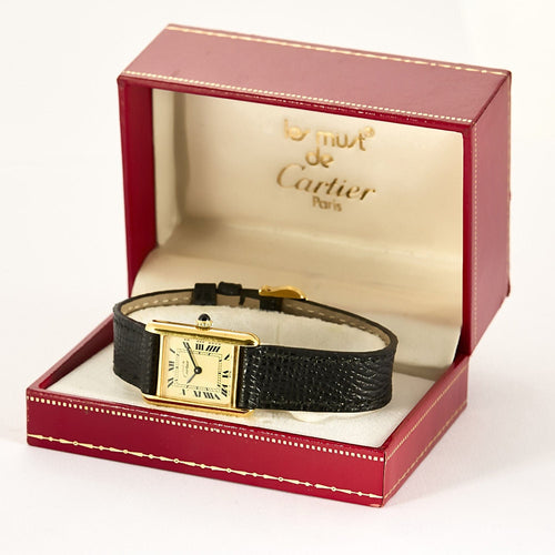 Montre CARTIER - Montre Tank Must en argent plaqué or, cadran blanc chiffres romains 58 Facettes