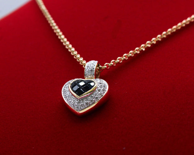 Pendentif Pendentif coeur or bicolore, saphirs, diamants 58 Facettes 250253