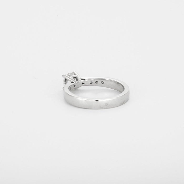 White gold solitaire adorned with diamonds