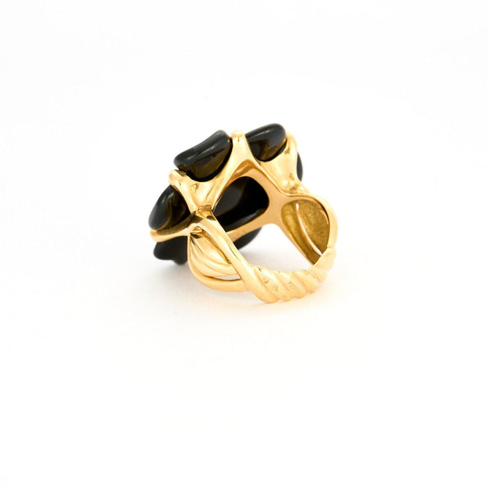 Bague 56 CHANEL - Bague Camélia or jaune onyx 58 Facettes 120