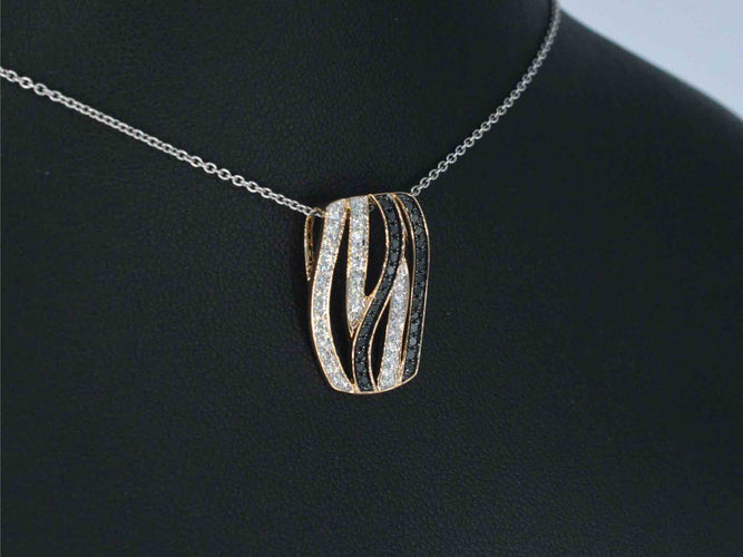 Pendentif Pendentif design en or rose avec diamants brillants blancs et noirs 58 Facettes 2245